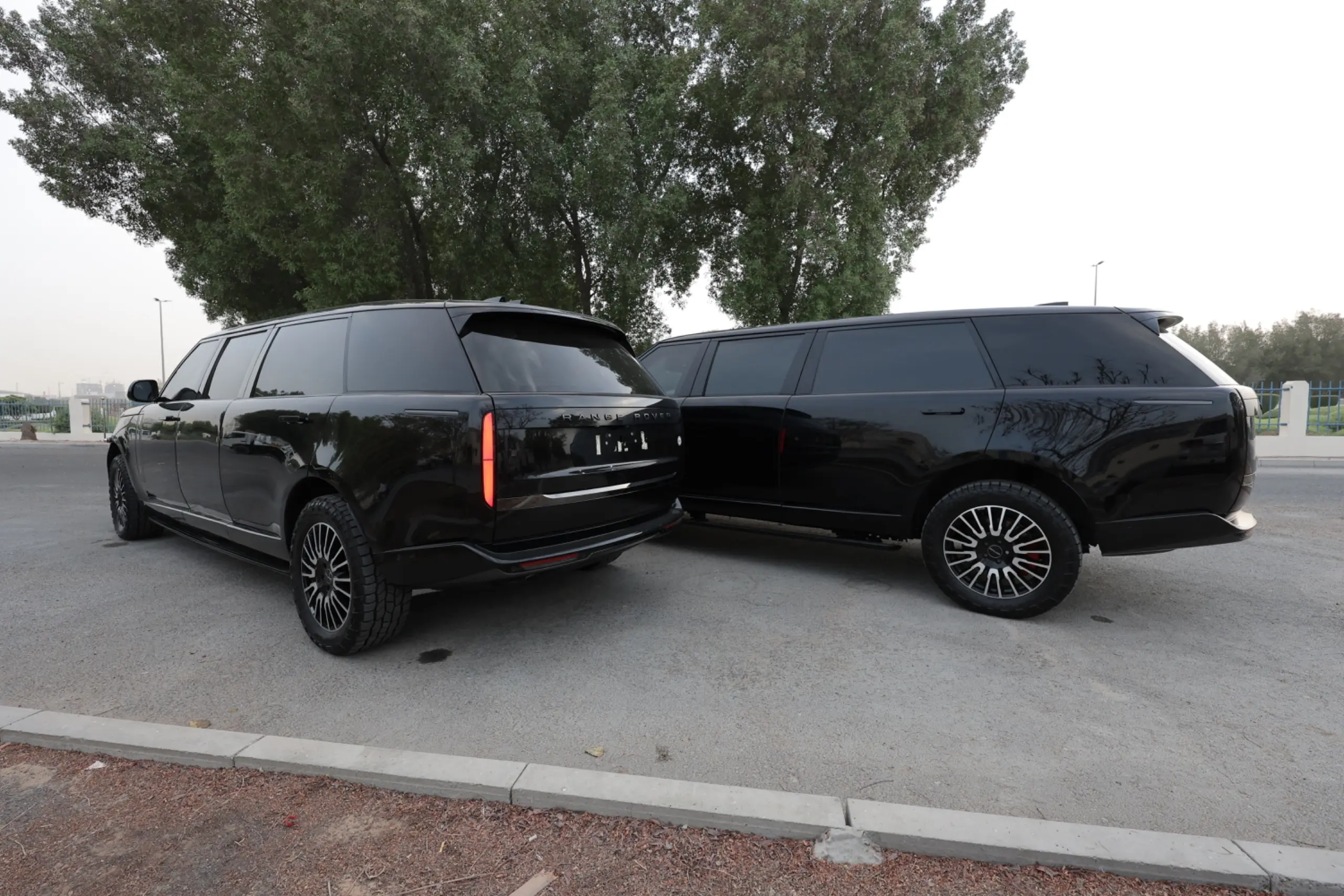 Range Rover BR6 extended armored SUVs back view in VIP convoy lineup