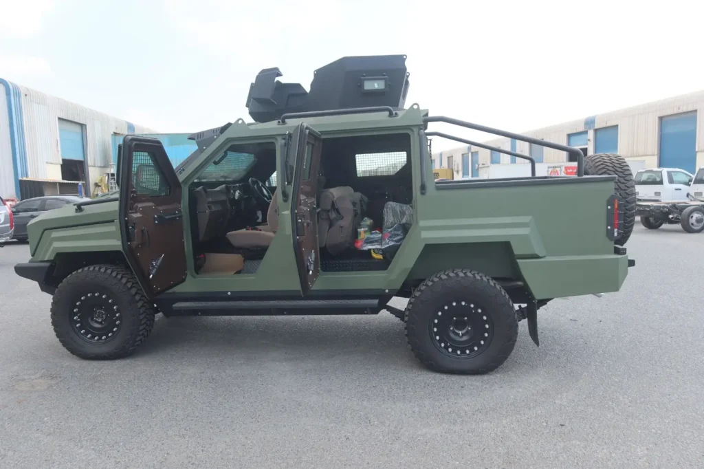 RHD GER 1D APC side view supporting armored SUV convoys for international operations