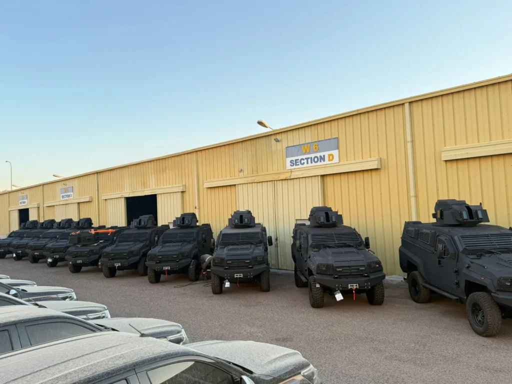 Black APC Tygor B7 outside warehouse